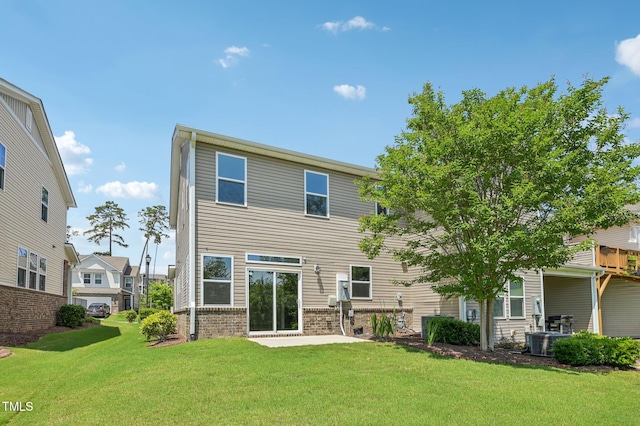 1534 Glenwater Dr, Cary, NC 27519 - back of house with a yard, a patio, brick siding, and central AC unit