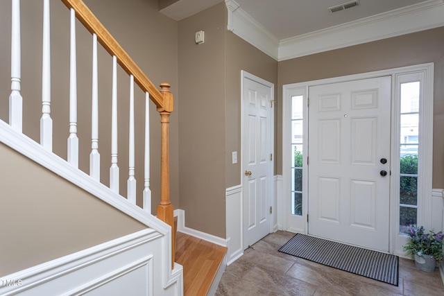 7244 Galon Glen Rd, Raleigh, NC 27613 - foyer entrance with crown molding, stairway, and baseboards