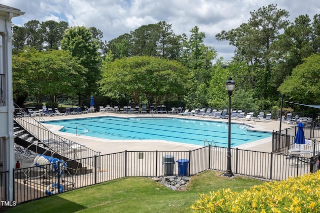 7244 Galon Glen Rd, Raleigh, NC 27613 - community pool featuring a patio and view of wooded area