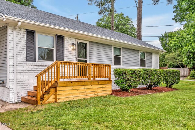 2200 Wyman Pl, Durham, NC 27707 - view of front of house with brick siding, roof with shingles, and a front lawn