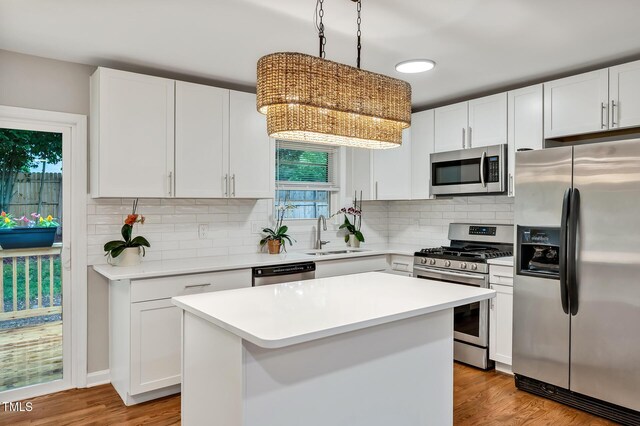 2200 Wyman Pl, Durham, NC 27707 - kitchen with stainless steel appliances, a sink, and white cabinets
