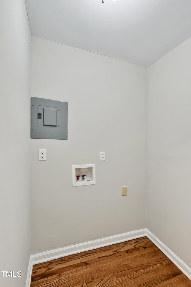 2200 Wyman Pl, Durham, NC 27707 - washroom with washer hookup, baseboards, electric panel, and wood finished floors