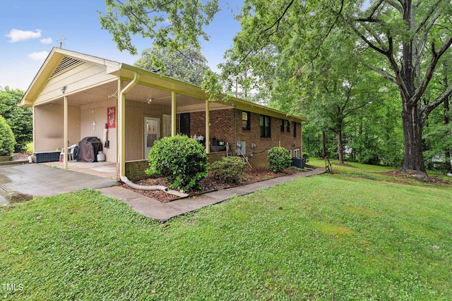 5932 Johnson Pond Rd, Fuquay Varina, NC 27526 - view of side of home featuring a yard and brick siding