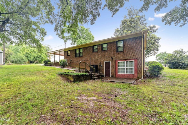 5932 Johnson Pond Rd, Fuquay Varina, NC 27526 - rear view of property featuring a yard and brick siding