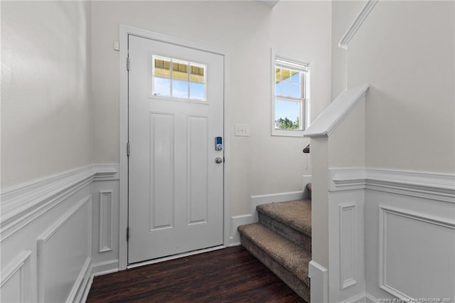 4572 Headwind Dr, Fayetteville, NC 28306 - foyer with stairway, dark wood-style floors, and wainscoting