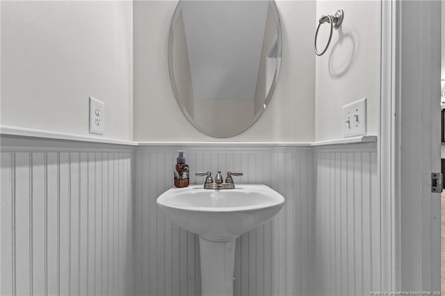 4572 Headwind Dr, Fayetteville, NC 28306 - bathroom with a wainscoted wall and a sink