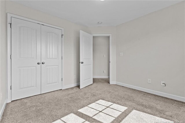 4572 Headwind Dr, Fayetteville, NC 28306 - unfurnished bedroom with carpet flooring, a closet, and baseboards