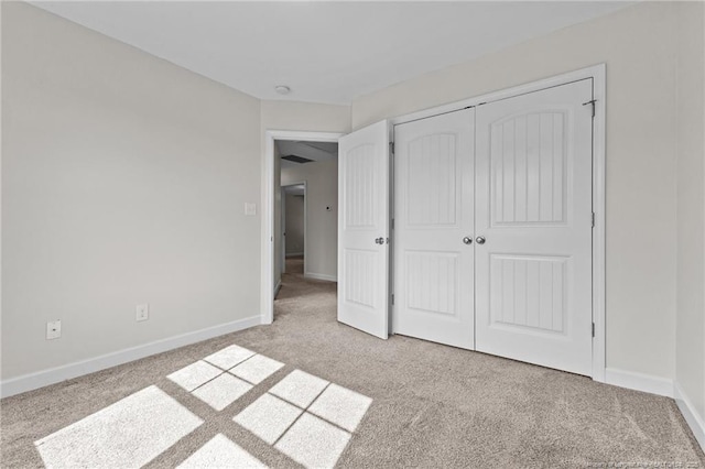 4572 Headwind Dr, Fayetteville, NC 28306 - unfurnished bedroom with light carpet, baseboards, and a closet