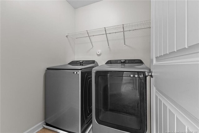 4572 Headwind Dr, Fayetteville, NC 28306 - washroom featuring washing machine and dryer and baseboards