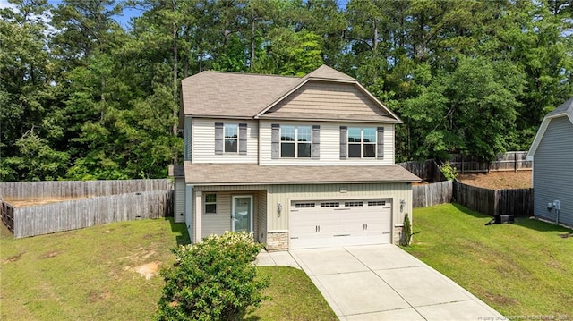 4572 Headwind Dr, Fayetteville, NC 28306 - craftsman-style home with concrete driveway, a garage, stone siding, and a shingled roof