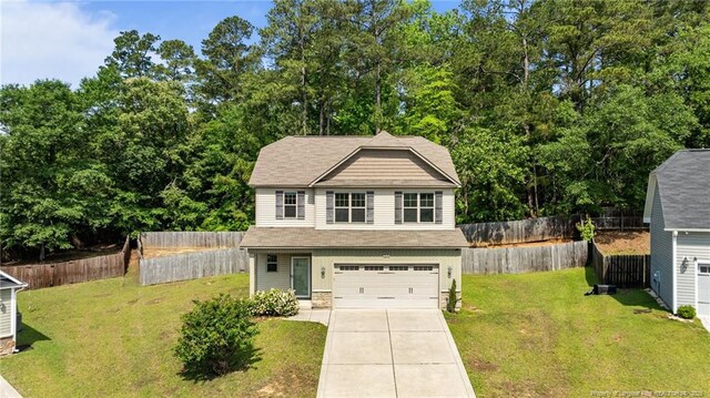 4572 Headwind Dr, Fayetteville, NC 28306 - view of front facade featuring a garage and driveway