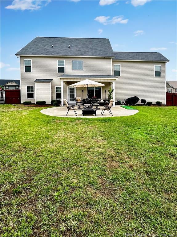 196 Wedgefield Dr, Raeford, NC 28376 - rear view of property with a patio