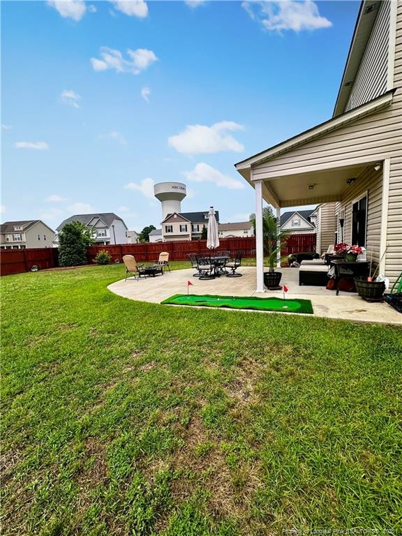 196 Wedgefield Dr, Raeford, NC 28376 - view of yard featuring a patio