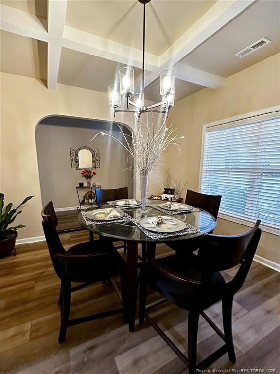 196 Wedgefield Dr, Raeford, NC 28376 - dining area featuring beam ceiling, baseboards, wood finished floors, and a chandelier