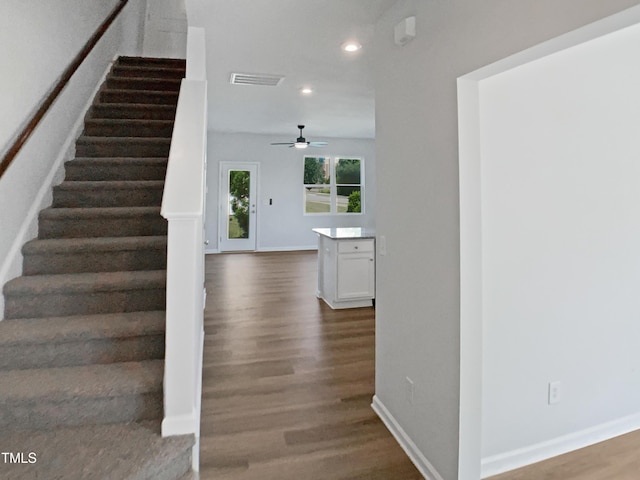 8891 Commons Townes Dr, Raleigh, NC 27616 - stairway with recessed lighting, wood finished floors, ceiling fan, and baseboards