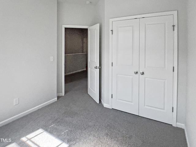 8891 Commons Townes Dr, Raleigh, NC 27616 - unfurnished bedroom with carpet, baseboards, and a closet