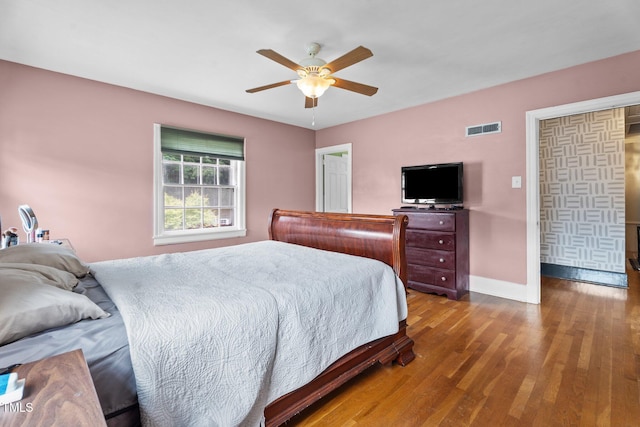 925 S Chestnut St, Henderson, NC 27536 - bedroom with baseboards, wood finished floors, and ceiling fan