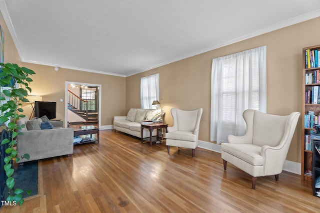 925 S Chestnut St, Henderson, NC 27536 - living room with wood finished floors, stairway, crown molding, baseboards, and a chandelier