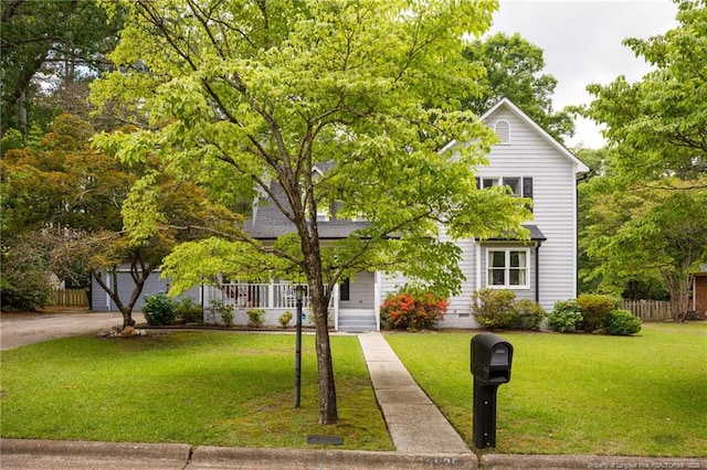 view of property hidden behind natural elements with a garage