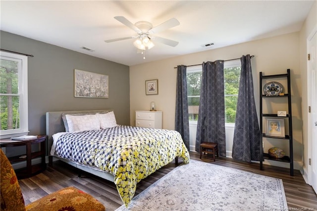 bedroom with dark wood-style flooring and ceiling fan