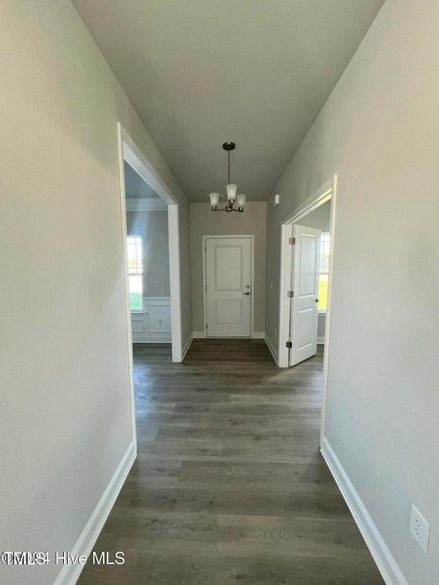 5134 Holly Hill Ct Lot 28, Battleboro, NC 27809 - hallway featuring a chandelier, baseboards, and dark wood finished floors