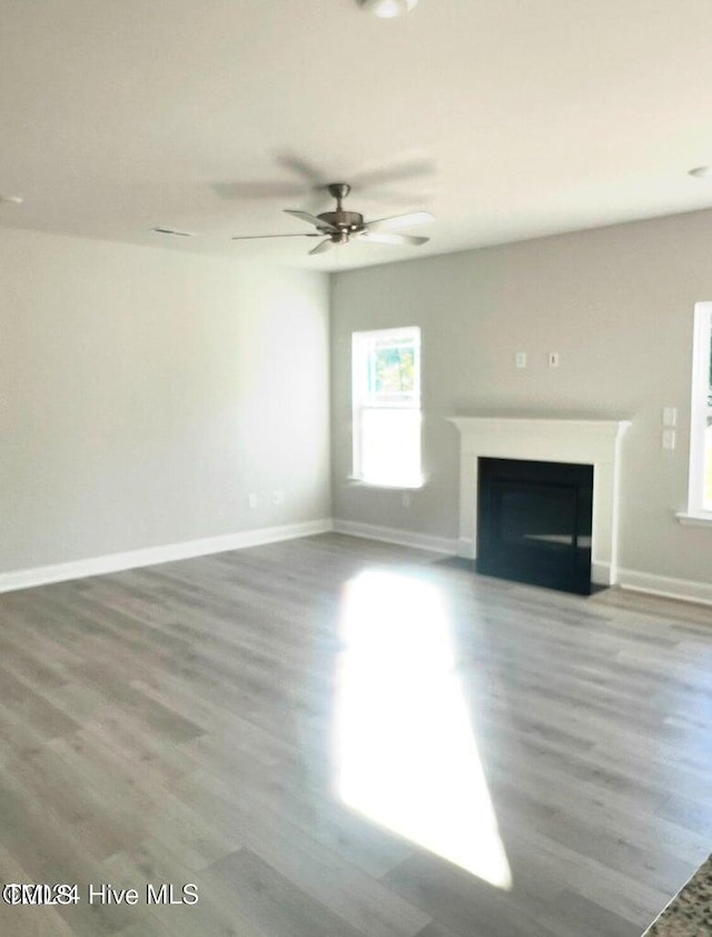 5134 Holly Hill Ct Lot 28, Battleboro, NC 27809 - unfurnished living room with a fireplace, wood finished floors, baseboards, and a ceiling fan