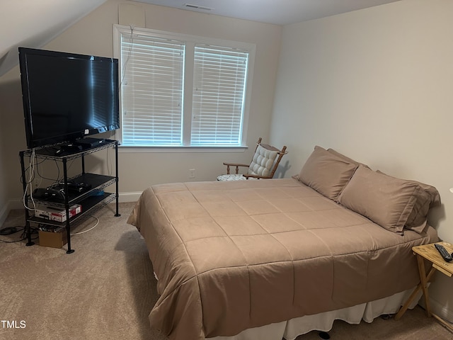 carpeted bedroom featuring baseboards