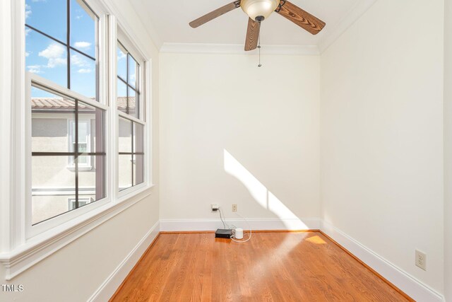 15 Treviso Pl, Durham, NC 27707 - spare room with baseboards, wood finished floors, ornamental molding, and a ceiling fan