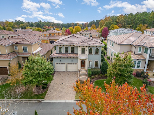 15 Treviso Pl, Durham, NC 27707 - mediterranean / spanish-style home featuring a residential view, driveway, and a tiled roof