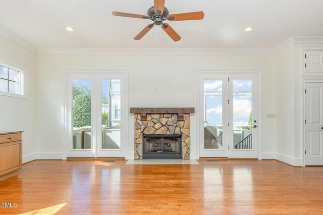 15 Treviso Pl, Durham, NC 27707 - unfurnished living room featuring light wood-style flooring, ornamental molding, baseboards, a fireplace, and a ceiling fan