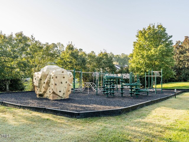 community play area with a lawn
