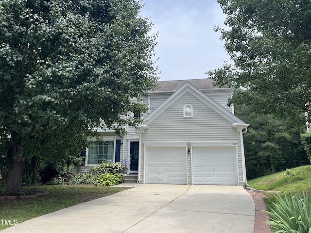 122 Button Rd, Morrisville, NC 27560 - view of front of home with concrete driveway and a garage