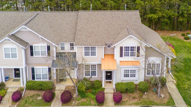 view of front of home featuring a shingled roof