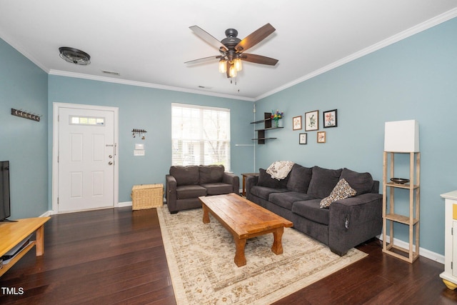 living room with dark wood finished floors, crown molding, a ceiling fan, and baseboards