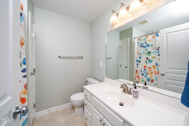 full bath with toilet, vanity, and baseboards