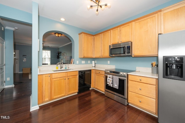 kitchen featuring stainless steel appliances, a sink, dark wood-type flooring, light countertops, and light brown cabinets
