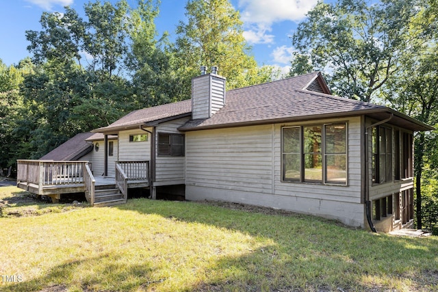 5900 Ebenezer Church Rd, Raleigh, NC 27612 - view of front of house featuring a chimney, a wooden deck, a front lawn, and a shingled roof