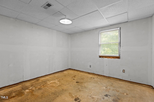 5900 Ebenezer Church Rd, Raleigh, NC 27612 - spare room with unfinished concrete flooring and a paneled ceiling