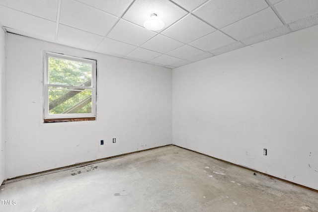 5900 Ebenezer Church Rd, Raleigh, NC 27612 - spare room featuring unfinished concrete flooring and a paneled ceiling