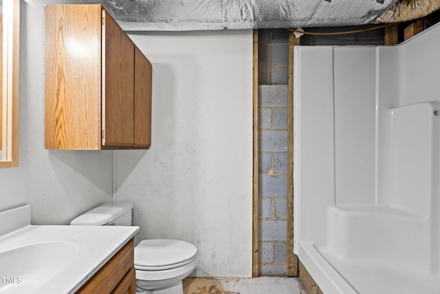 5900 Ebenezer Church Rd, Raleigh, NC 27612 - full bath with vanity, toilet, a shower, and concrete block wall