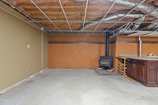 5900 Ebenezer Church Rd, Raleigh, NC 27612 - below grade area featuring a wood stove
