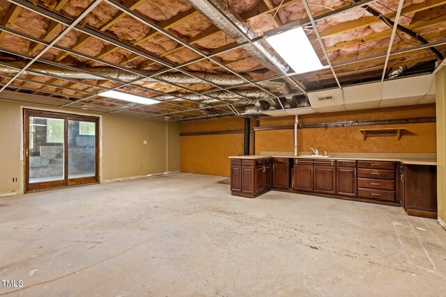 5900 Ebenezer Church Rd, Raleigh, NC 27612 - basement featuring a sink