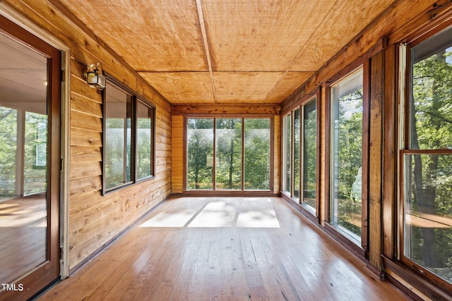 5900 Ebenezer Church Rd, Raleigh, NC 27612 - unfurnished sunroom with wood ceiling, wood-type flooring, and wood walls