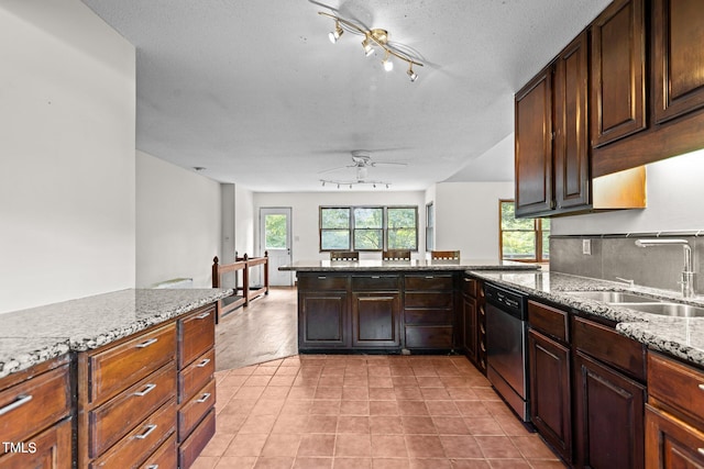5900 Ebenezer Church Rd, Raleigh, NC 27612 - kitchen with stainless steel dishwasher, a ceiling fan, a sink, a peninsula, and light stone countertops