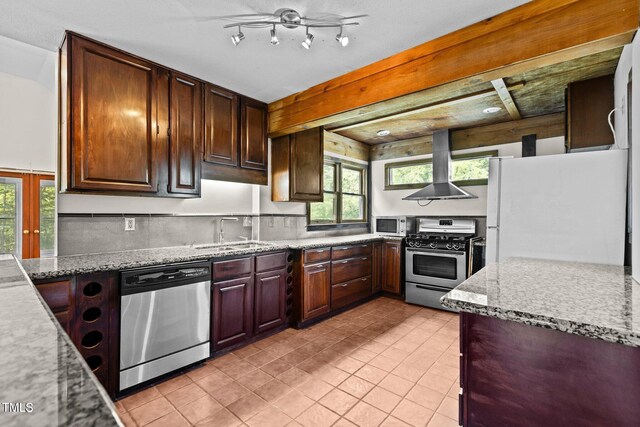 5900 Ebenezer Church Rd, Raleigh, NC 27612 - kitchen featuring appliances with stainless steel finishes, wall chimney exhaust hood, a sink, light tile patterned floors, and light stone countertops