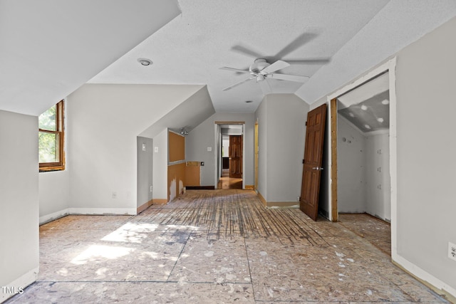 5900 Ebenezer Church Rd, Raleigh, NC 27612 - bonus room featuring a ceiling fan, vaulted ceiling, baseboards, and a textured ceiling