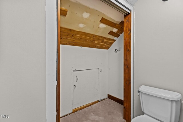 5900 Ebenezer Church Rd, Raleigh, NC 27612 - bathroom featuring vaulted ceiling and toilet