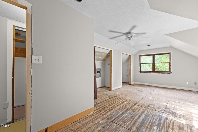 5900 Ebenezer Church Rd, Raleigh, NC 27612 - additional living space with a ceiling fan, lofted ceiling, and a textured ceiling
