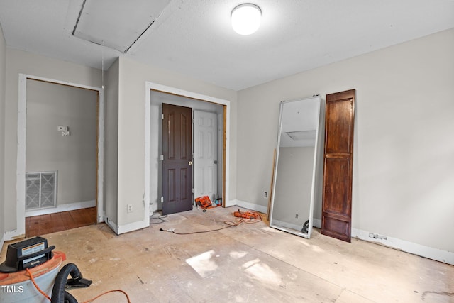 5900 Ebenezer Church Rd, Raleigh, NC 27612 - unfurnished bedroom with attic access and baseboards
