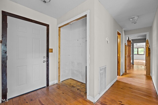 5900 Ebenezer Church Rd, Raleigh, NC 27612 - foyer entrance featuring hardwood / wood-style floors and baseboards